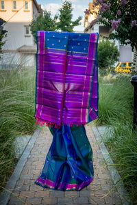 Blue-Teal Kanchipuram Silk Saree with a Bright Magenta Border