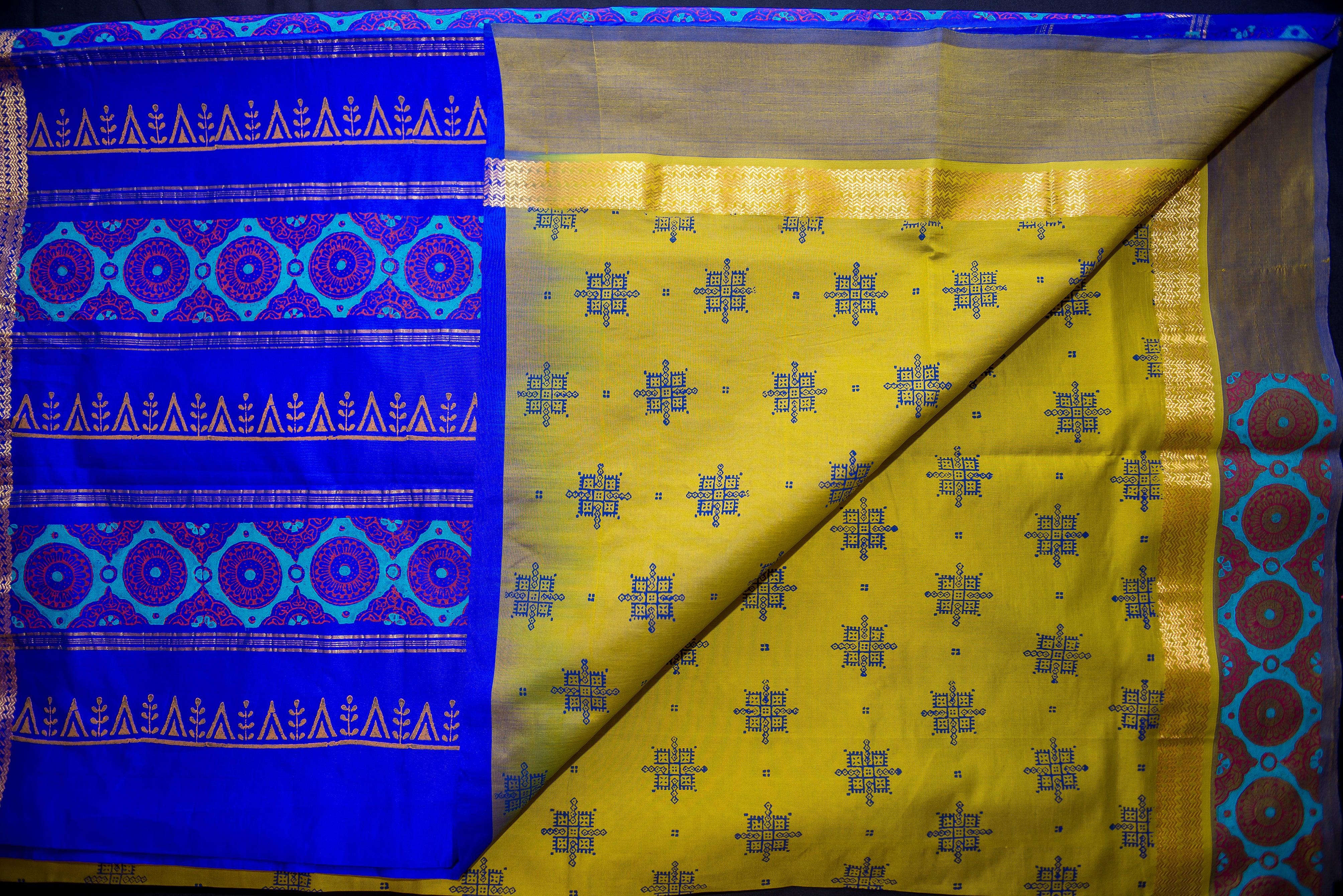 Vibrant Olive Green Silk Cotton Saree with a Deep Blue Artistic Pallu