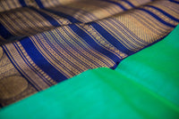 Emerald Green Silk Cotton Saree with Navy Blue-Golden Border