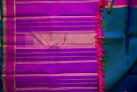 Blue-Teal Kanchipuram Silk Saree with a Bright Magenta Border