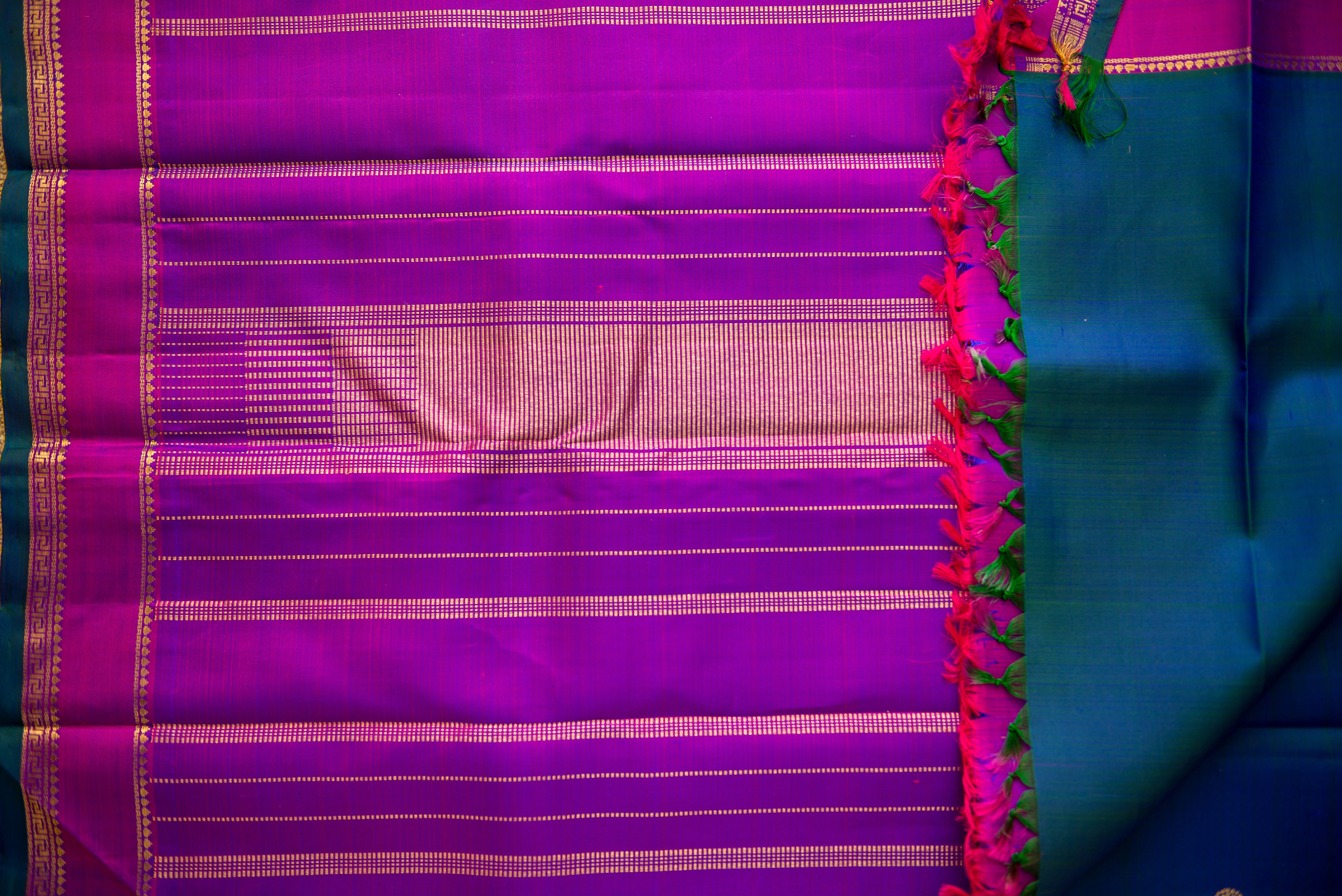 Blue-Teal Kanchipuram Silk Saree with a Bright Magenta Border