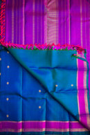 Blue-Teal Kanchipuram Silk Saree with a Bright Magenta Border