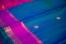 Blue-Teal Kanchipuram Silk Saree with a Bright Magenta Border