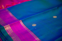 Blue-Teal Kanchipuram Silk Saree with a Bright Magenta Border